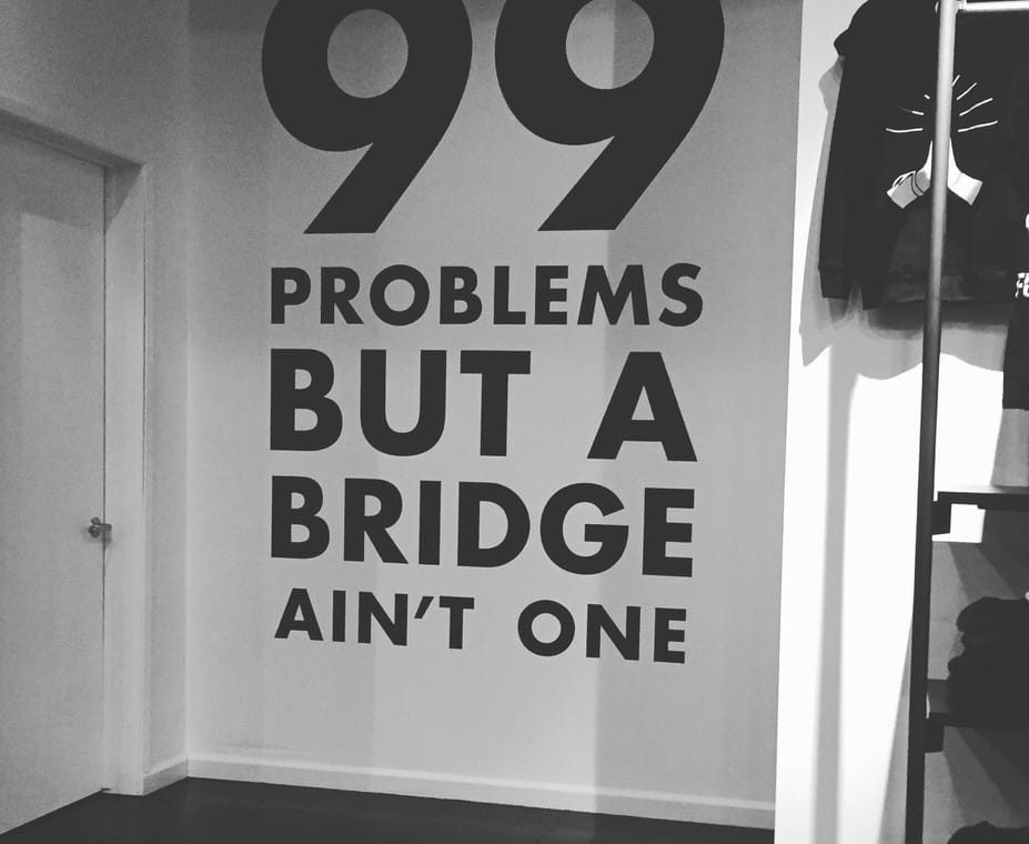Wall that says 99 Problems but a bridge ain't one at Y7