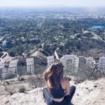 Erin sitting behind the Los Angeles Hollywood sign