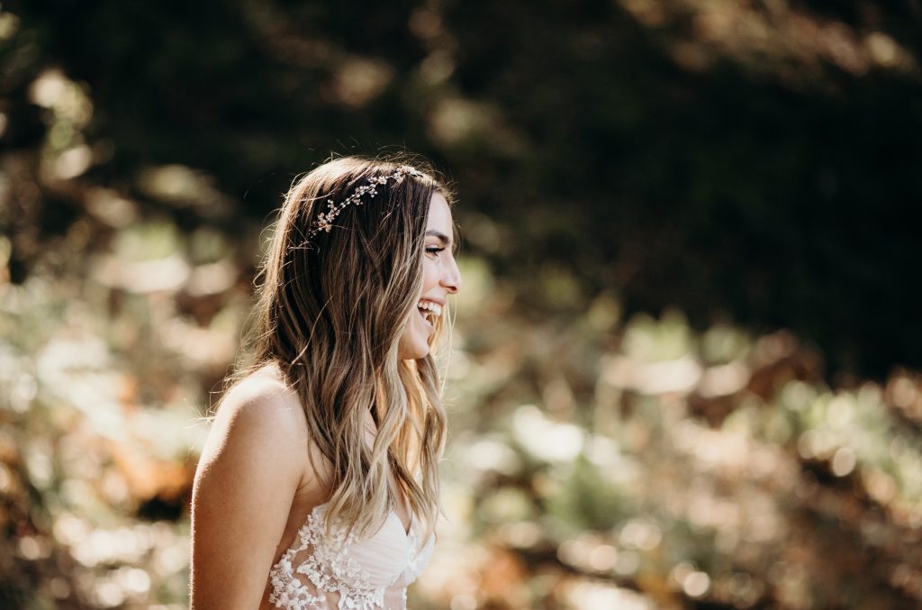 Erin laughing while in her wedding gown